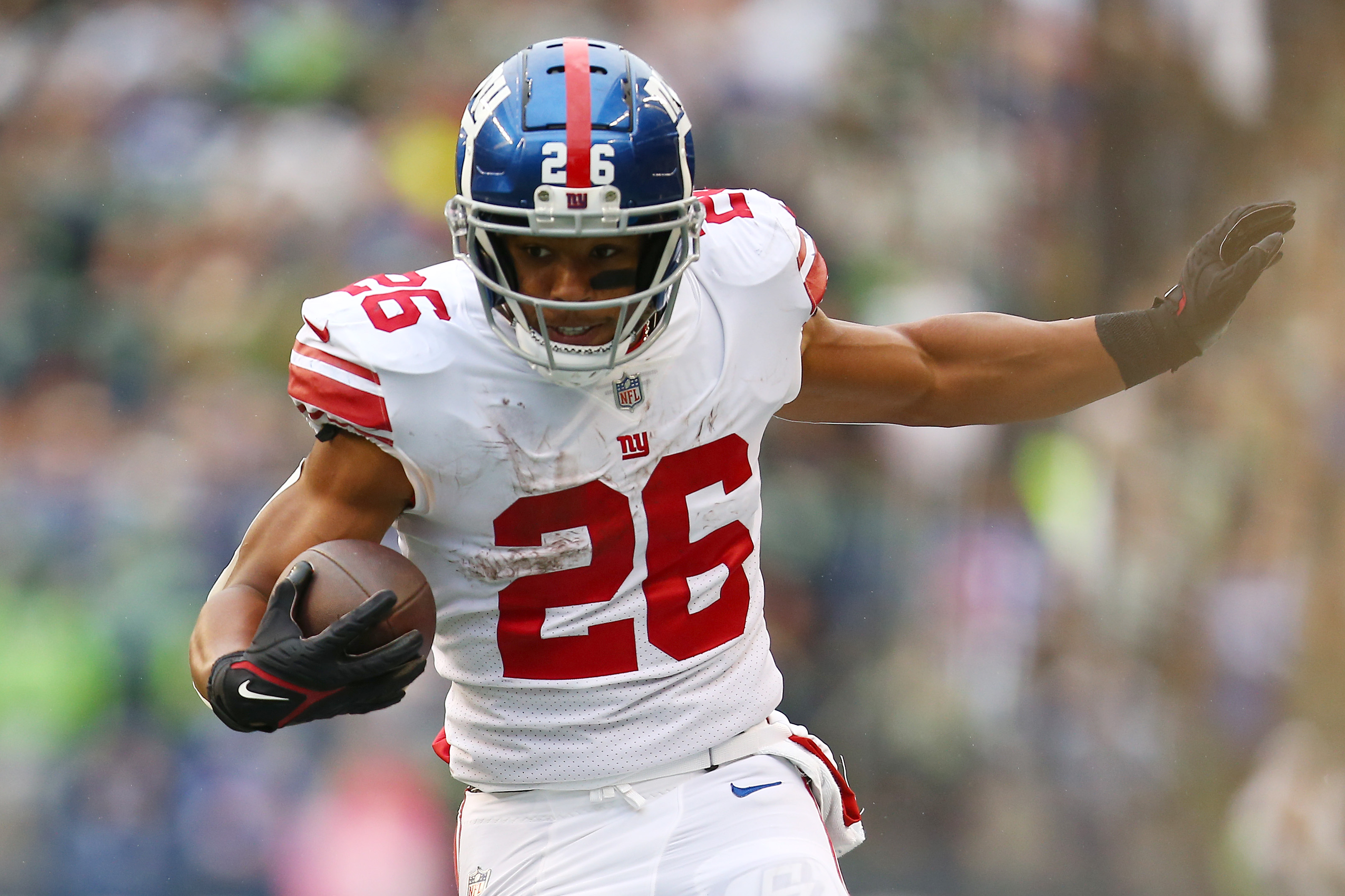 Running back Saquon Barkley of the New York Giants runs with the ball in the game against the Seattle Seahawks at Lumen Field in Seattle, Washington, October 30, 2022. /CFP