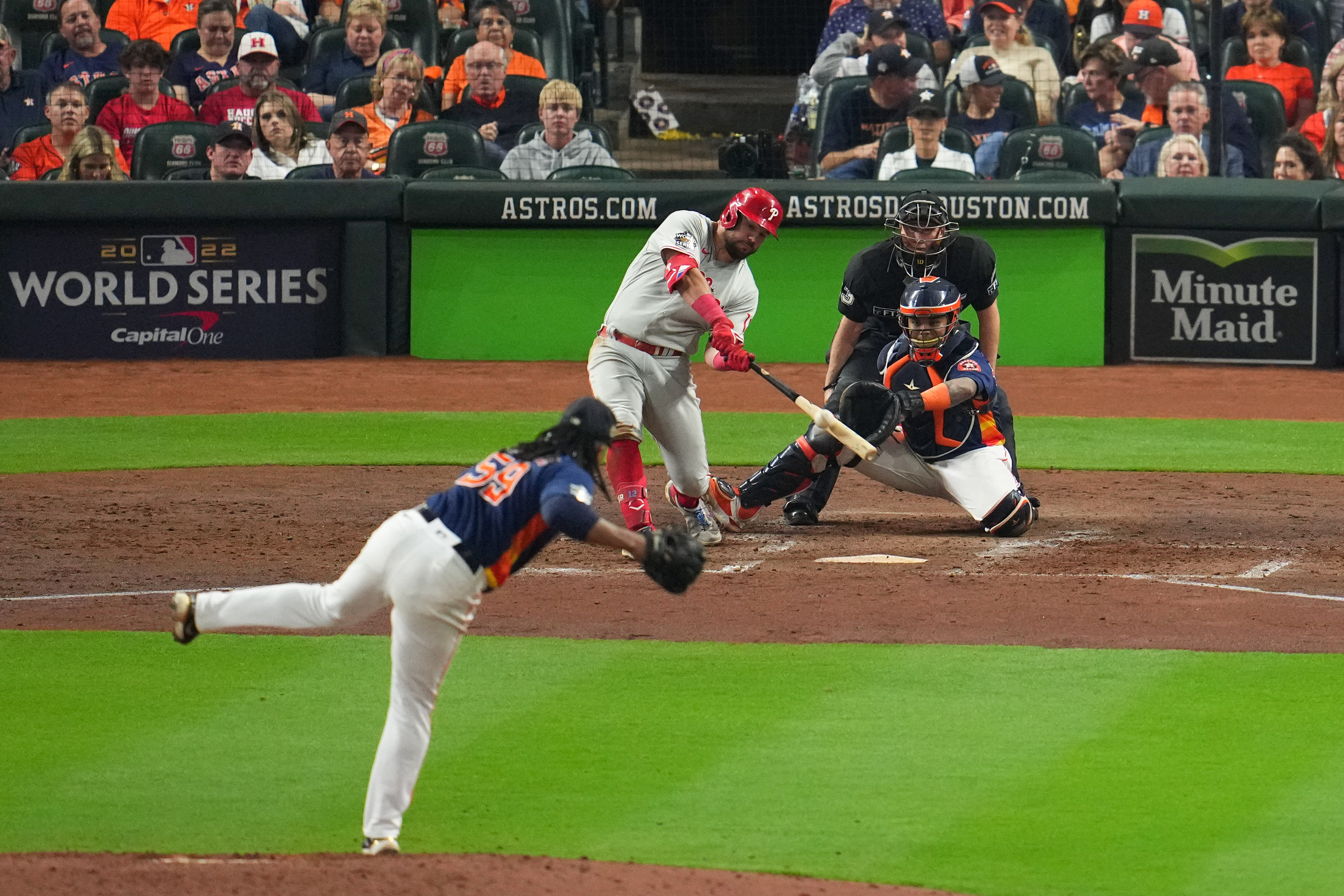 Left fielder Kyle Schwarber (left in the back) of the Philadelphia Phillies hits a solo home run during the sixth inning in Game 6 of the MLB World Series against the Houston Astros at Minute Maid Park in Houston, Texas, November 5, 2022. /CFP