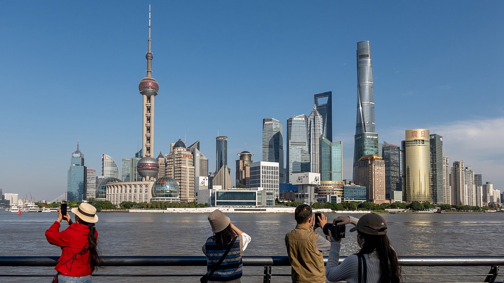 Visitors taking pictures of the city skyline at the Bund, Shanghai, China, October 10, 2022. /CFP