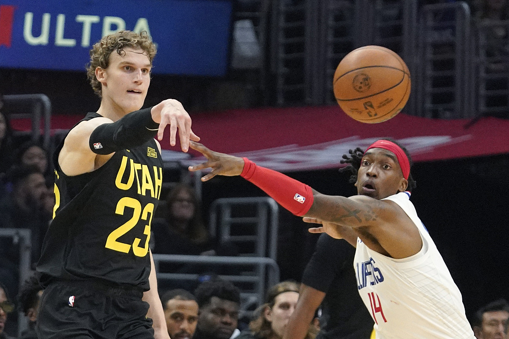Lauri Markkanen (#23) of the Utah Jazz passes in the game against the Los Angeles Clippers at Crypto.com Arena in Los Angeles, California