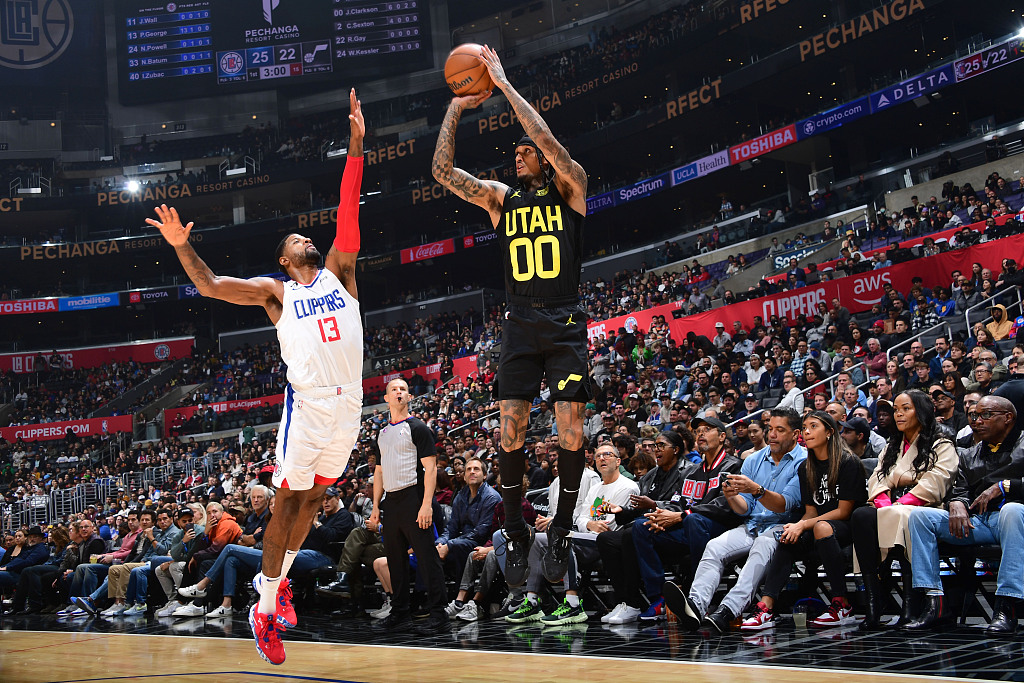 Jordan Clarkson (#00) of the Utah Jazz shoots in the game against the Los Angeles Clippers at Crypto.com Arena in Los Angeles, California