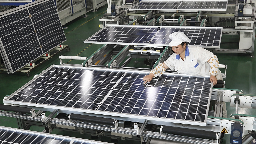 A worker at the production line of a photovoltaic enterprise in east China's Jiangsu Province, November 2, 2022. /CFP