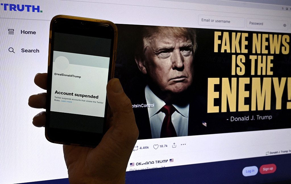 The suspended Twitter account of former U.S. President Donald Trump is displayed on a mobile phone with Trump's Truth webpage shown in the background in Washington, D.C., U.S., October 28, 2022. /CFP