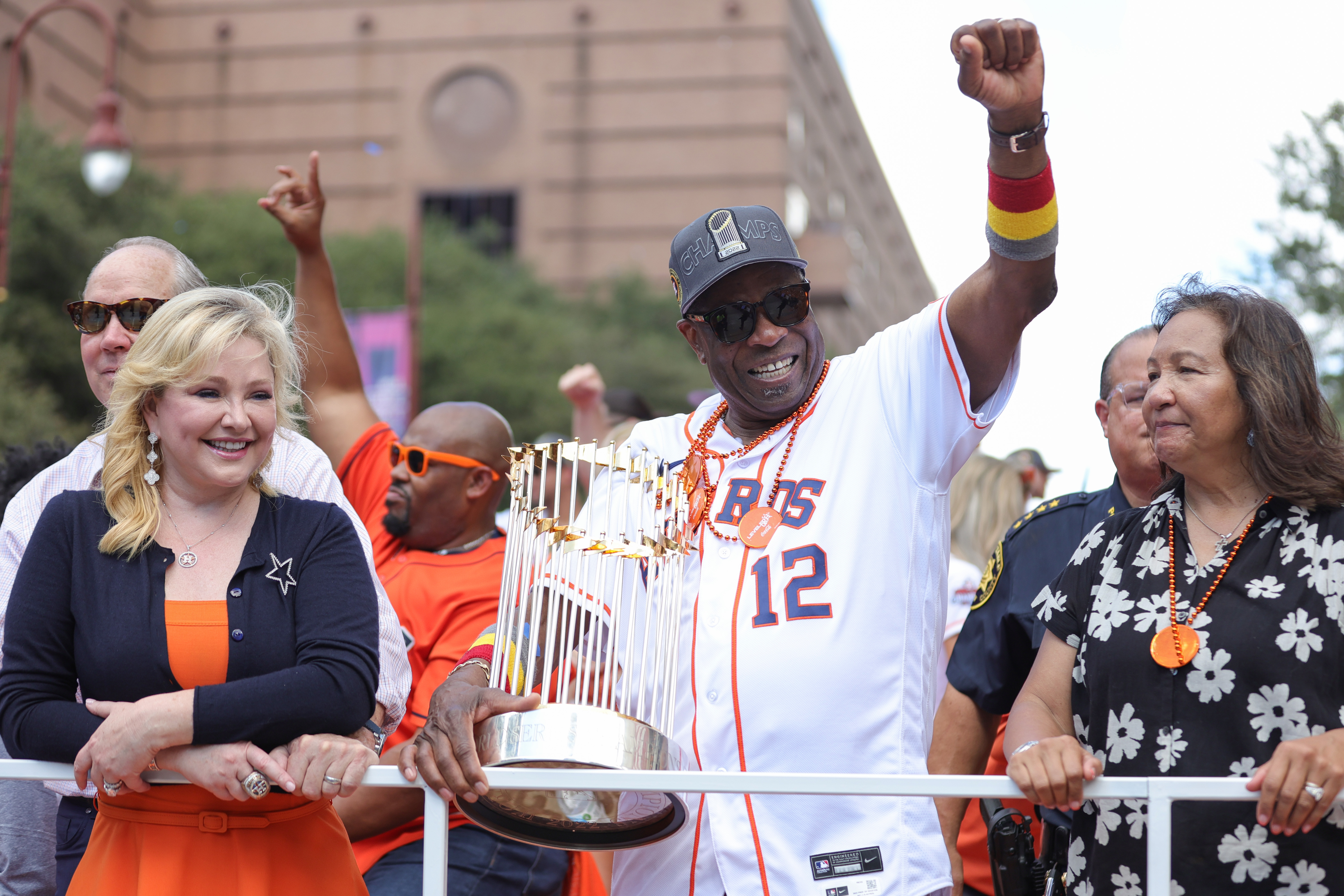 Dusty Baker (C), manager of the houston Astros, celebrates with the MLB World Series championship trophy, the Commissioner's Trophy, during the parade in Houston, Texas, November 7, 2022. /CFP