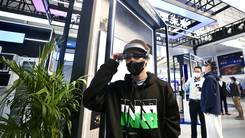 Visitors experience epson industrial glasses at the Light of the Internet Expo before the World Internet Conference in Wuzhen, November 8, 2022. /CFP