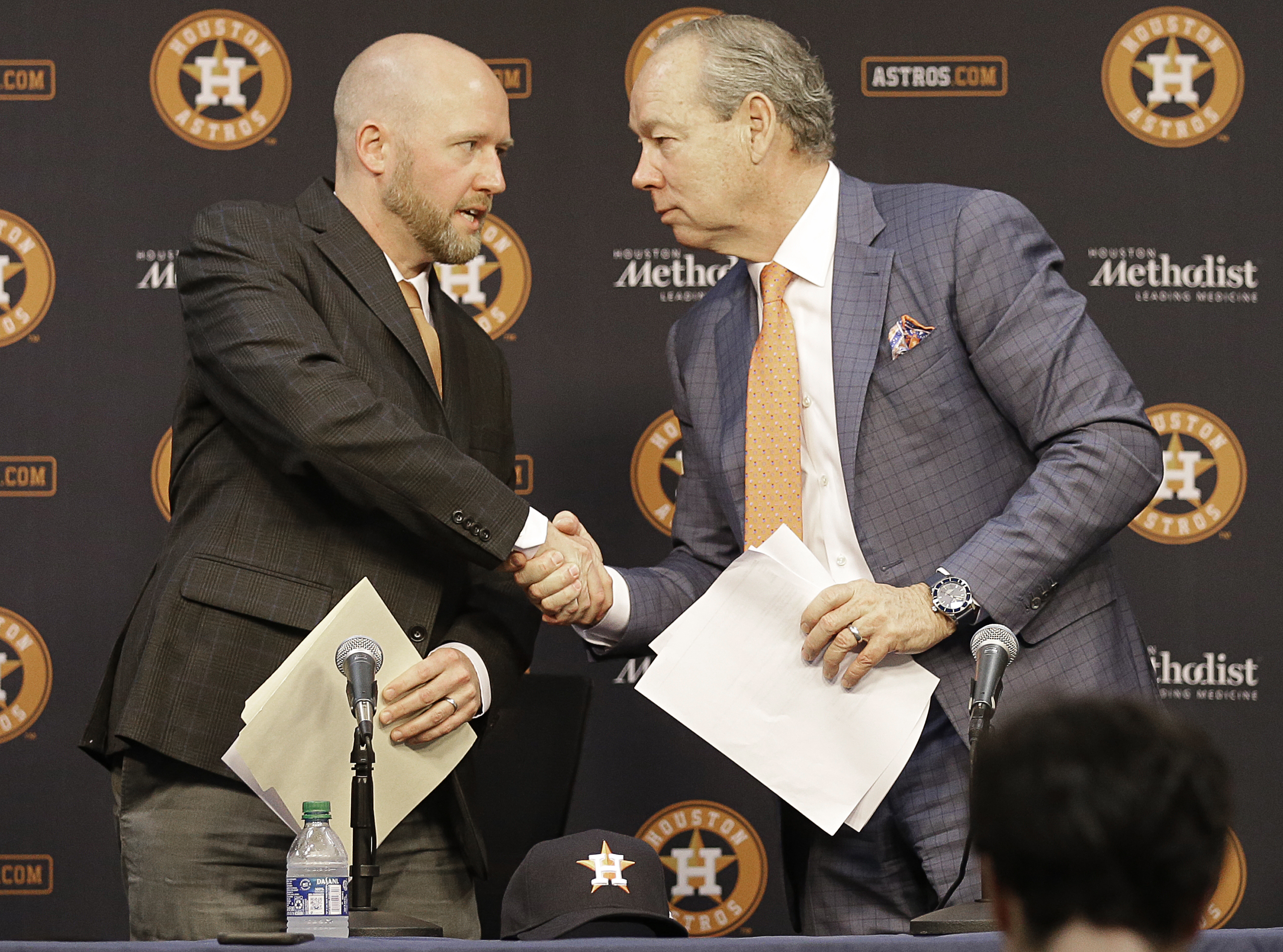 James Click (L), general manager of the Houston Astros, shakes hands with the team owner Jim Crane at the press conference at Minute Maid Park in Houston, Texas, February 4, 2020. /CFP