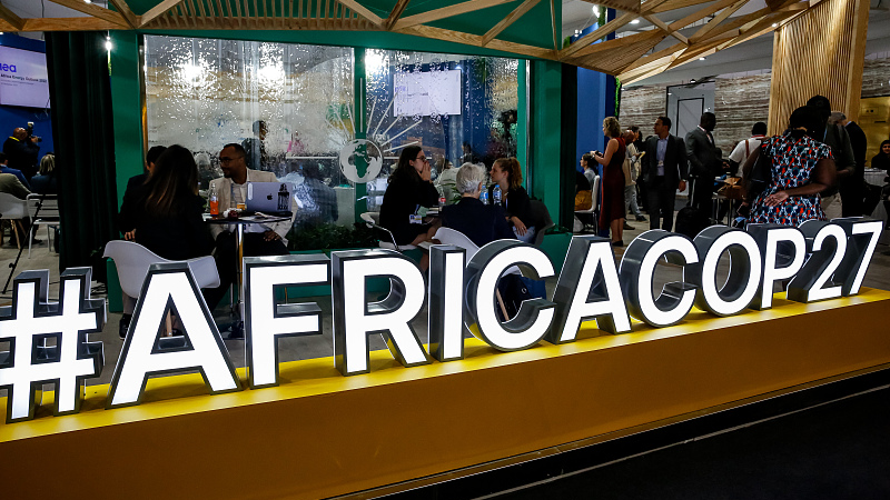Participants sit in an African Pavilion during the COP27, Sharm El Sheikh, Egypt, November 11. /CFP
