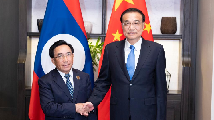Chinese premier discusses closer cooperation with Lao counterpart - CGTN