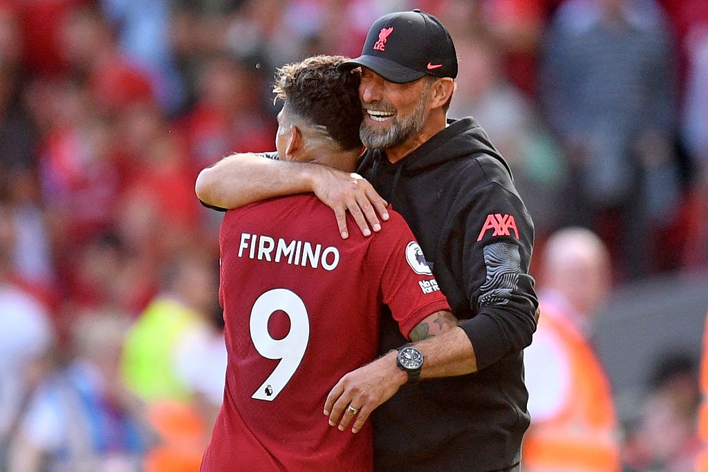 Roberto Firmino (#9) of Liverpool hugs his manager Jurgen Klopp during the Premier League game against Bournemouth at Anfield in Liverpool, England, August 27, 2022. /CFP