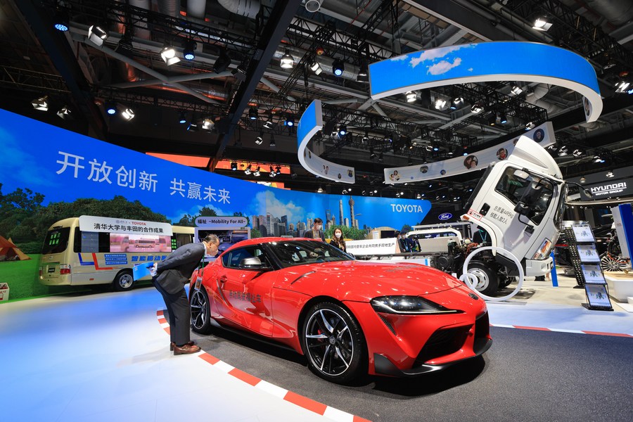 A visitor looks at a car at the booth of Toyota at the fifth China International Import Expo in east China's Shanghai, November 6, 2022. /Xinhua