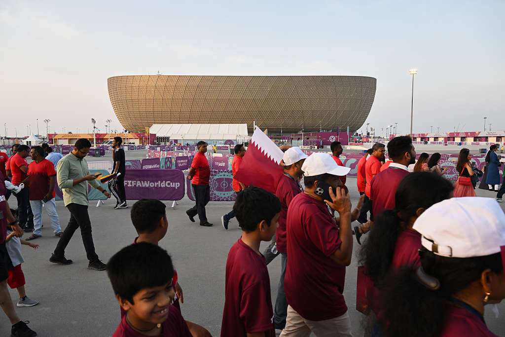 Fans walk passed the Lusail Stadium before FIFA World Cup Qatar 2022 in Lusail, Qatar, November 18, 2022. /CFP