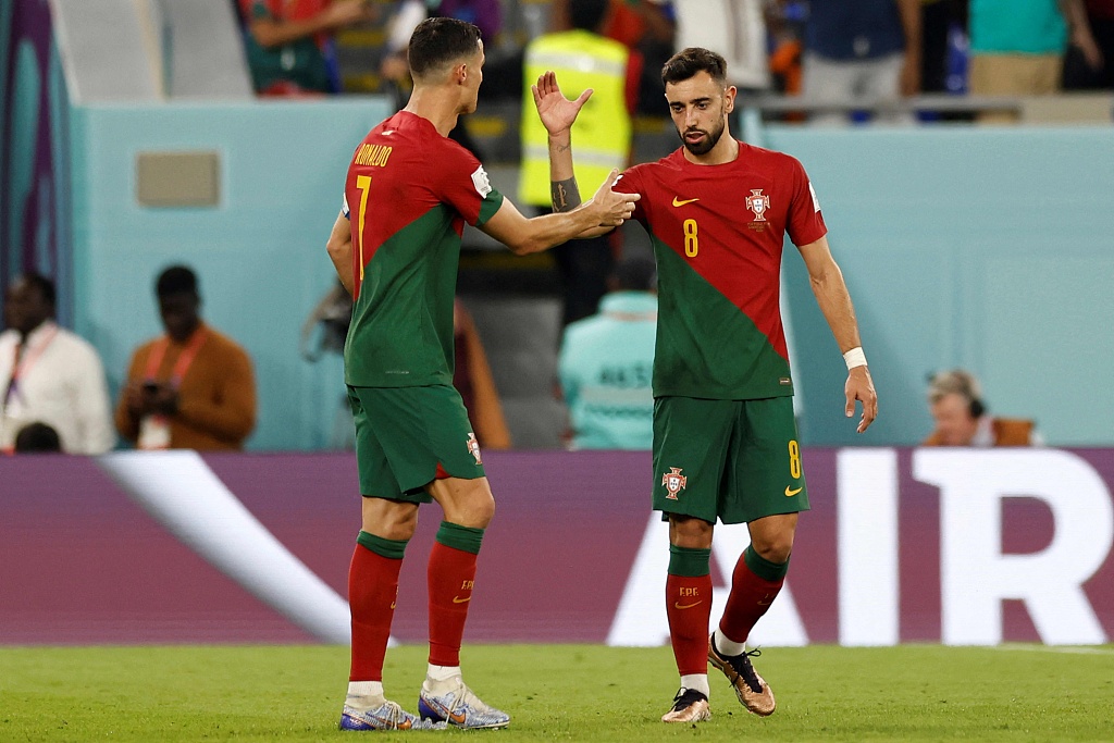 Bruno Fernandes (R) and Cristiano Ronaldo of Portugal look on in the FIFA World Cup game against Ghana at Stadium 974 in Doha, Qatar, November 24, 2022. /CFP