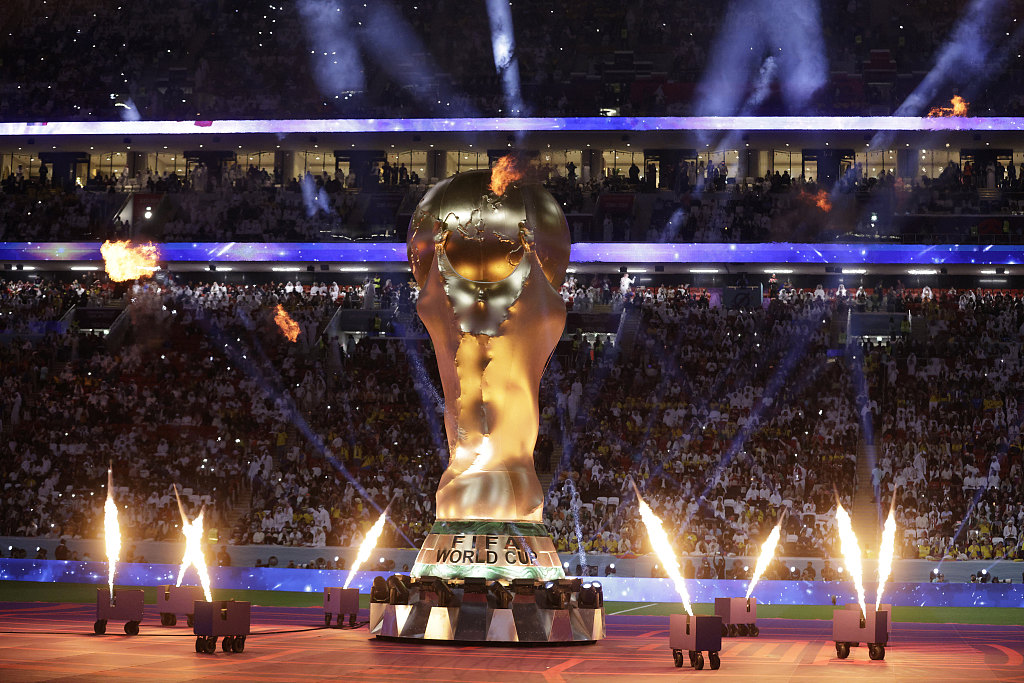 A giant World Cup trophy with fireworks is displayed at the opening ceremony of the 2022 Qatar World Cup in Doha, November 20, 2022. /CFP