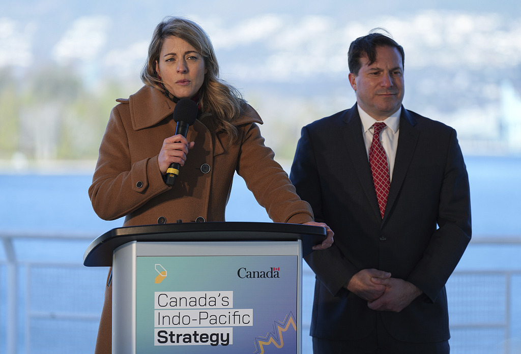 Canada's Foreign Minister Melanie Joly (L) responds to questions as Public Safety Minister Marco Mendocino listens during a news conference to announce Canada's 