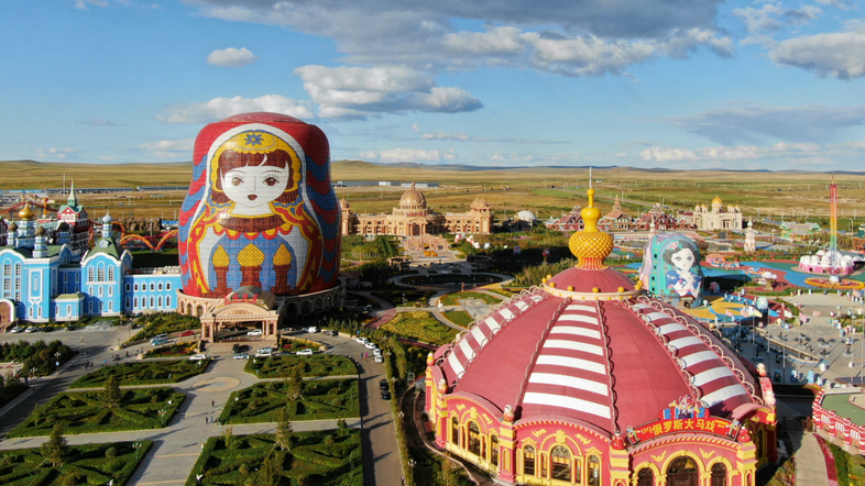 A square decorated with oversized Russian Matryoshka dolls in Manzhouli, a China-Mongolia-Russia border port city, in north China's Inner Mongolia Autonomous Region, September 7, 2018. /Xinhua