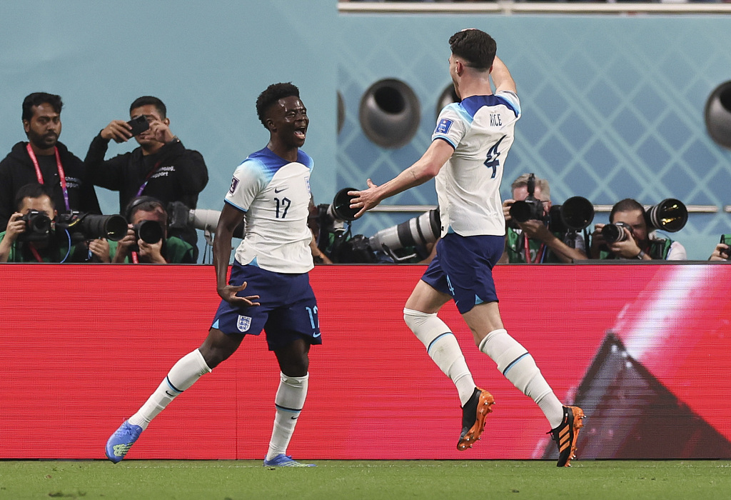 Bukayo Saka (L) of England celebrates after scoring a goal in the FIFA World Cup game against Iran at Khalifa International Stadium in Doha, Qatar, November 21, 2022. /CFP 