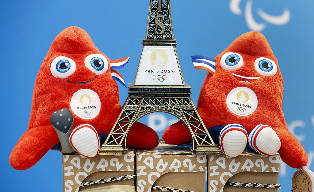 A replica of the Eiffel Tower surrounded by official mascots for the Paris 2024 Summer Olympic and Paralympic Games is displayed inside an official store of the Games in Paris, France, November 15, 2022. /CFP