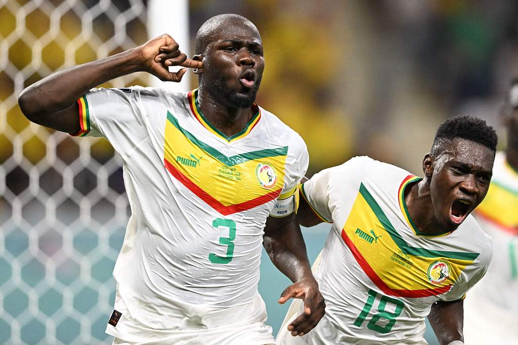 Kalidou Koulibaly (L) of Senegal celebrates scoring a goal against Ecuador during their World Cup Group A match in which Senegal won 2-1 in Doha, Qatar, November 29, 2022. /CFP