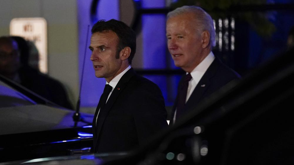 U.S. President Joe Biden (R) and French President Emmanuel Macron depart after dinner at Fiola Mare in Washington, U.S., November. 30, 2022. /AP