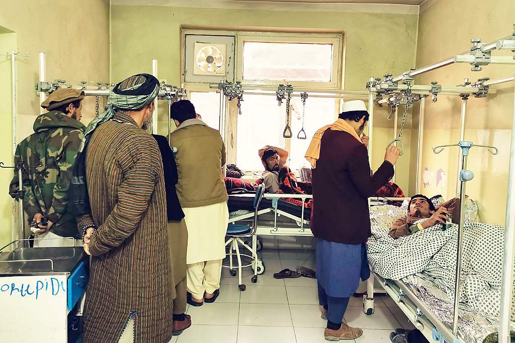 Wounded Afghan men receive treatment at a hospital following a blast at a madrassa in Aybak city of Samangan province, November 30, 2022. /CFP
