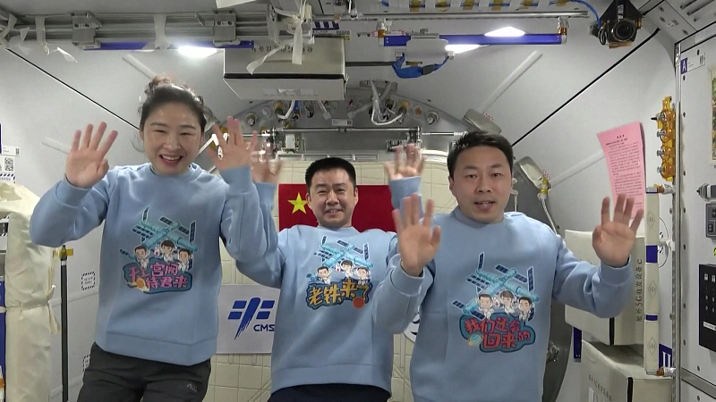 China's Shenzhou-14 crew members (from left to right) Liu Yang, Chen Dong and Cai Xuzhe at the space station greet the Shenzhou-15 crew members in a video released on Novemver 29, 2022. /CMSA