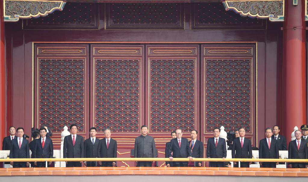 President Xi Jinping (C), also general secretary of the Communist Party of China Central Committee and chairman of the Central Military Commission, stands on Tian'anmen Rostrum with Jiang Zemin (R, next to Xi) and other Party and state leaders during celebrations to mark the 70th anniversary of the founding of the People's Republic of China, Beijing, October 1, 2019. /Xinhua