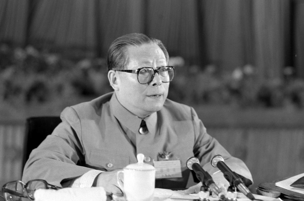 Jiang Zemin addresses the fourth plenary session of the 13th Communist Party of China Central Committee in Beijing, June 1989. /Xinhua