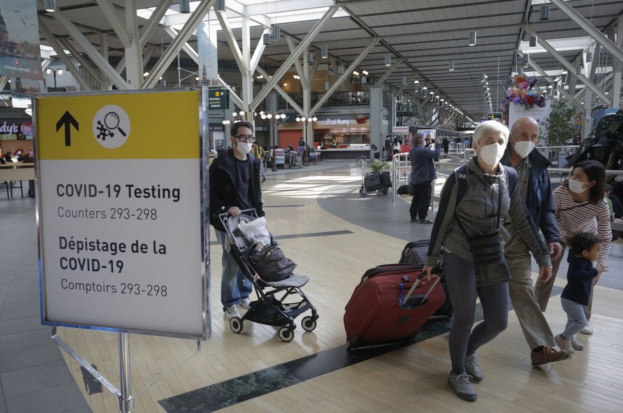 A sign showing the location for COVID-19 testing at Vancouver International Airport in Richmond, Canada, September 26, 2022. /Xinhua
