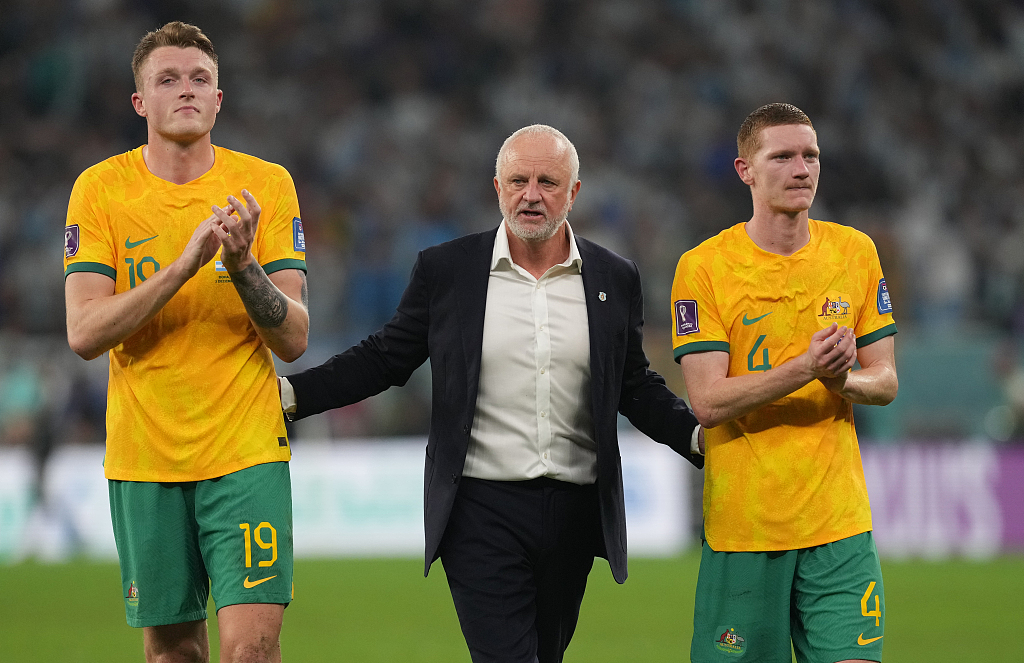 L-R: Harry Souttar, manager Graham Arnold and Kye Rowles of Australia look on after the 2-1 loss to Argentina in the FIFA World Cup Round of 16 game at Ahmad Bin Ali Stadium in Doha, Qatar, December 3, 2022. /CFP 