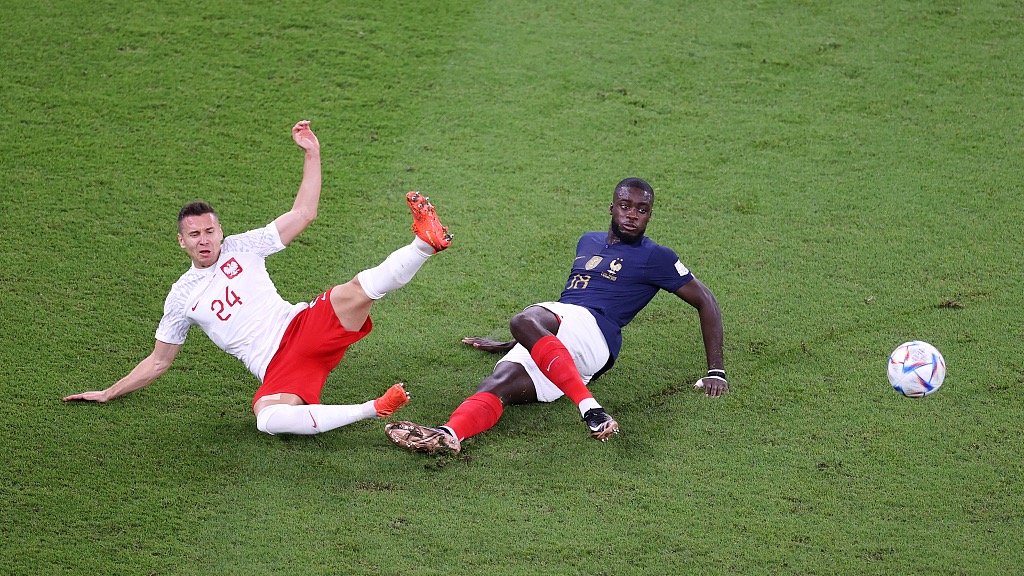 Przemyslaw Frankowski (L) of Poland battles for possession with Dayot Upamecano of France during their World Cup clash with Poland at Al Thumama Stadium in Doha, Qatar, December 4, 2022. /CFP