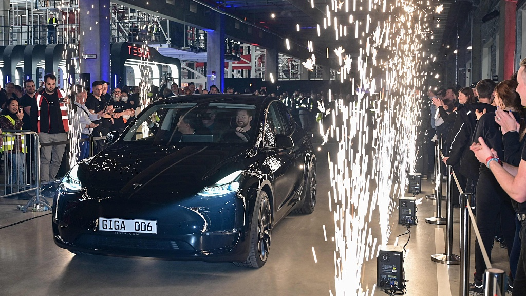 An electric vehicle of the Tesla model Y drives away during the start of the production at Tesla's 