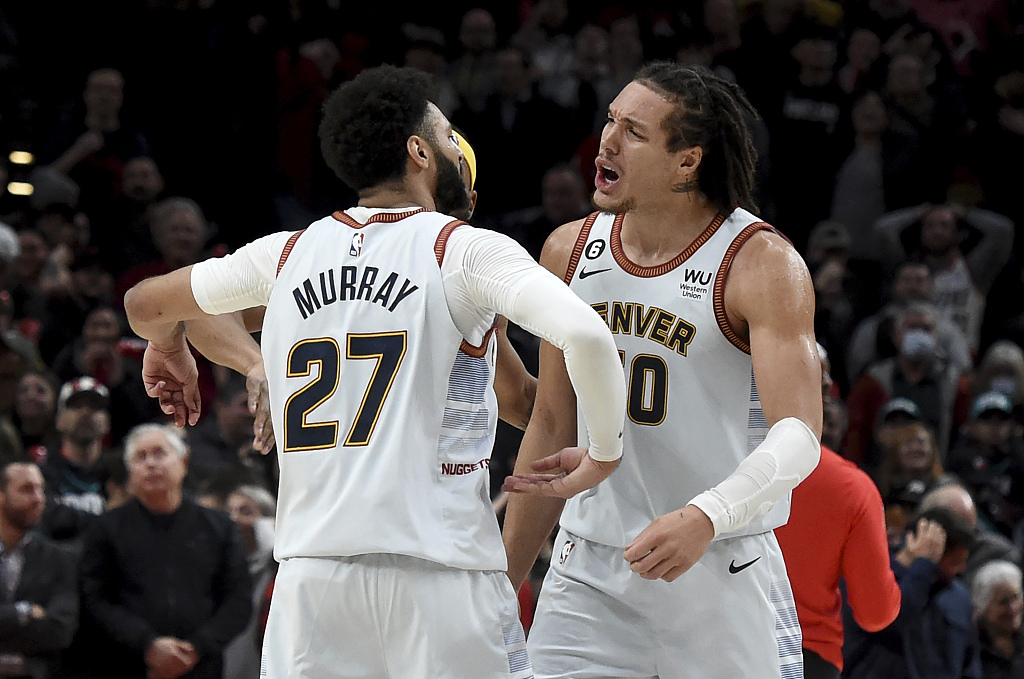 Jamal Murray (#27) and Aaron Gordon of the Denver Nuggets celebrate after Murray makes the game-winning shot against the Portland Trail Blazers at Moda Center in Portland, Oregon, December 8, 2022. /CFP