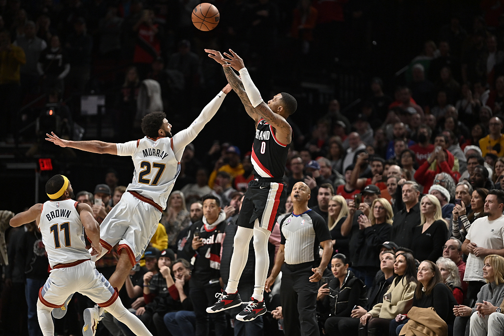 Damian Lillard (#0) of the Portland Trail Blazers shoots in the game against the Denver Nuggets at Moda Center in Portland, Oregon, December 8, 2022. /CFP