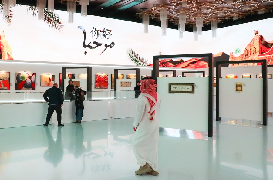 People visit an art exhibition in Riyadh, Saudi Arabia, December 8, 2022. /Xinhua