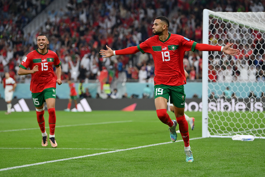Youssef En-Nesyri of Morocco (R) celebrates after scoring a goal during the World Cup quarterfinal match against Portugal in Doha, Qatar, December 10, 2022. /CFP
