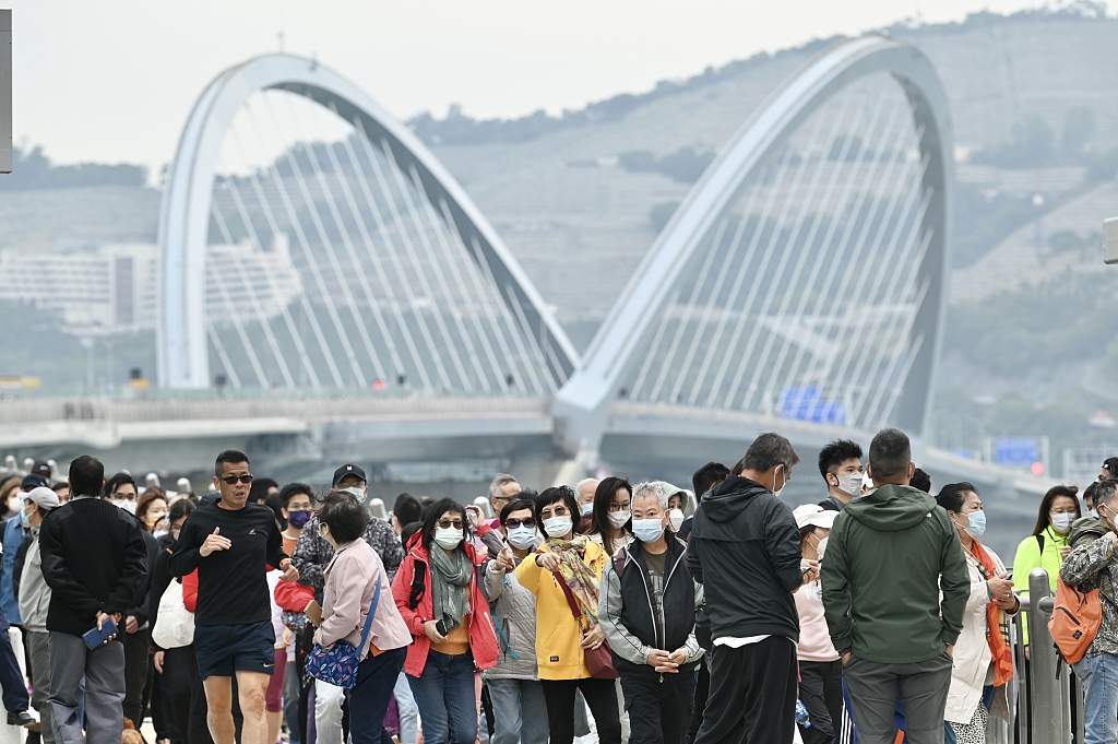 People visit the Tseung Kwan O Cross Bay Bridge , December 11, 2022. /CP 
