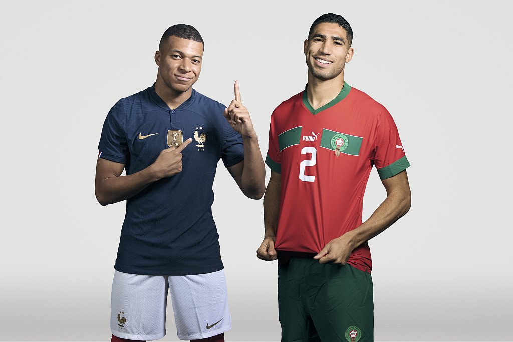 Kylian Mbappe (L) of France and Achraf Hakimi of Morocco pose for a portrait during the FIFA World Cup in Qatar. The two teams will play each other in the semifinals at Al Bayt Stadium in Qatar on December 14, 2022. /CFP