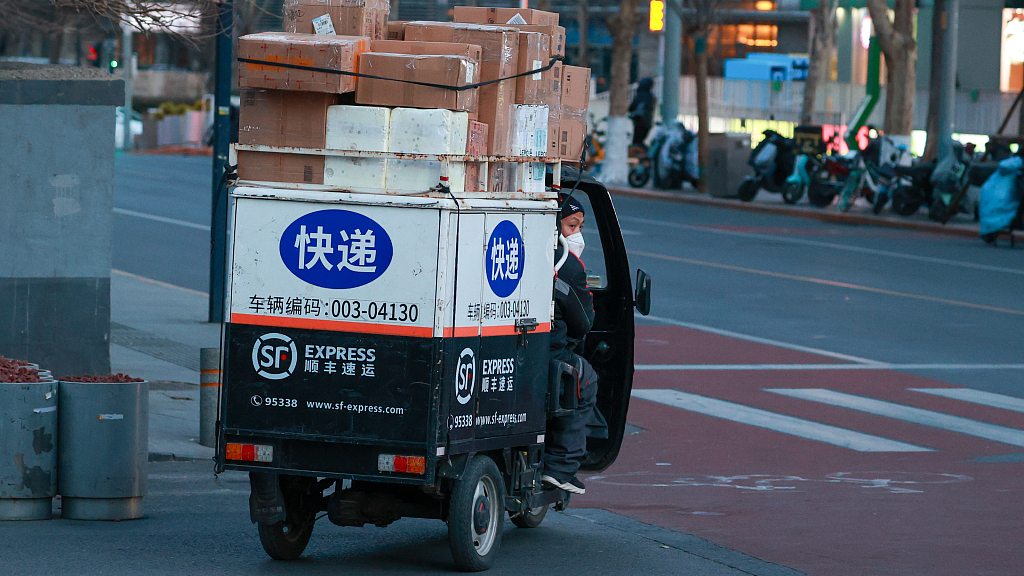 A delivery cargo tricycle loaded with parcels is seen in Beijing, China, December 15, 2022. /CFP