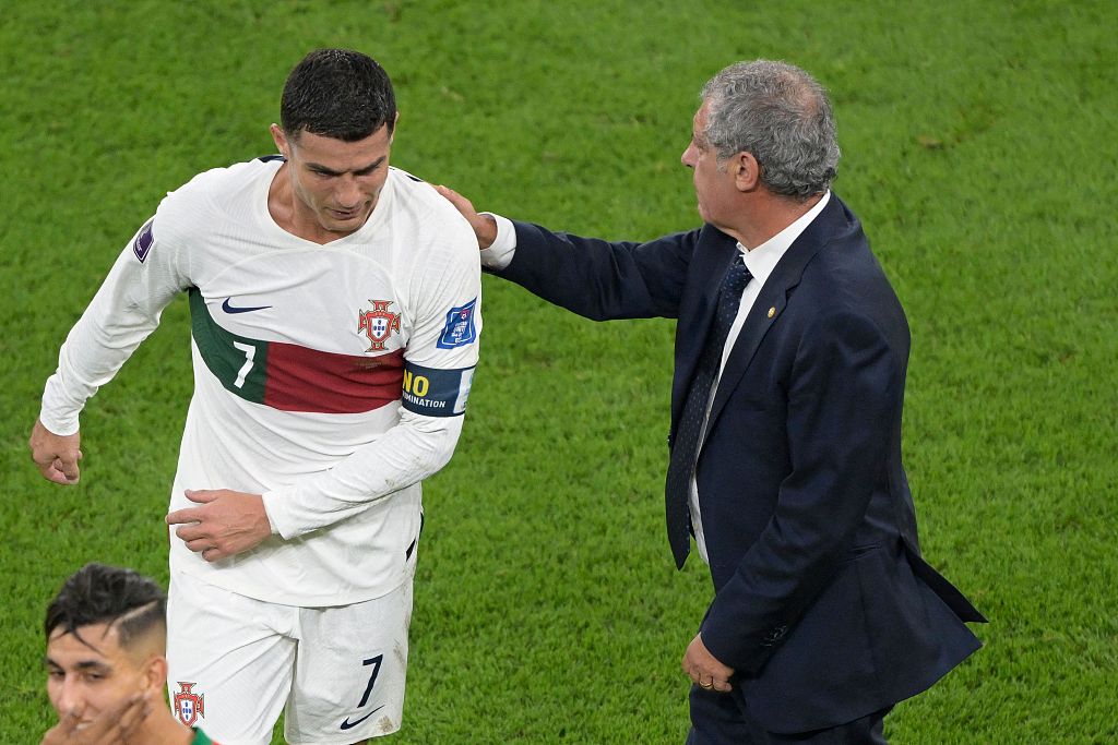 Portugal coach Fernando Santos (R) consoles Cristiano Ronaldo after their World Cup loss to Morocco at Al Thumama Stadium in Doha, Qatar, December 10, 2022. /CFP