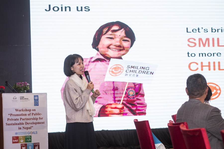 A project manager from the China Foundation for Rural Development speaks about the Smiling Children Project in Lalitpur, Nepal, December 16, 2022. /Xinhua