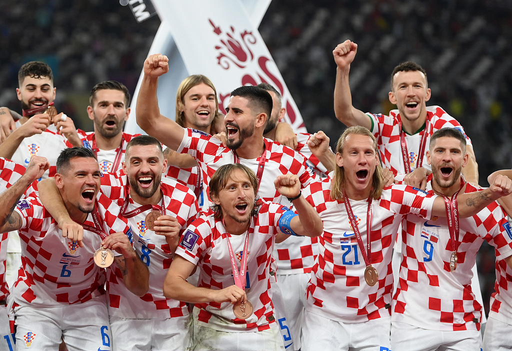 Croatia players celebrate during the awarding ceremony after their World Cup win over Morocco at Khalifa International Stadium in Doha, Qatar, December 17, 2022. /CFP