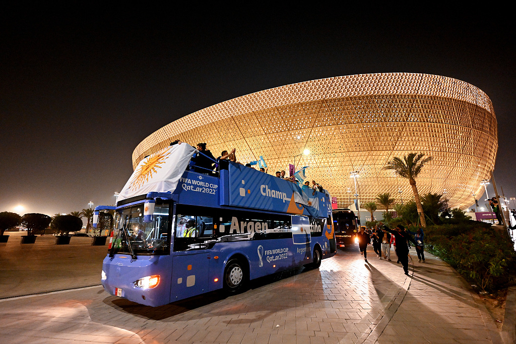 Argentina depart the Lusail Stadium on an open top bus as they parade with the FIFA World Cup Trophy in Lusail City, Qatar, December 18, 2022. /CFP