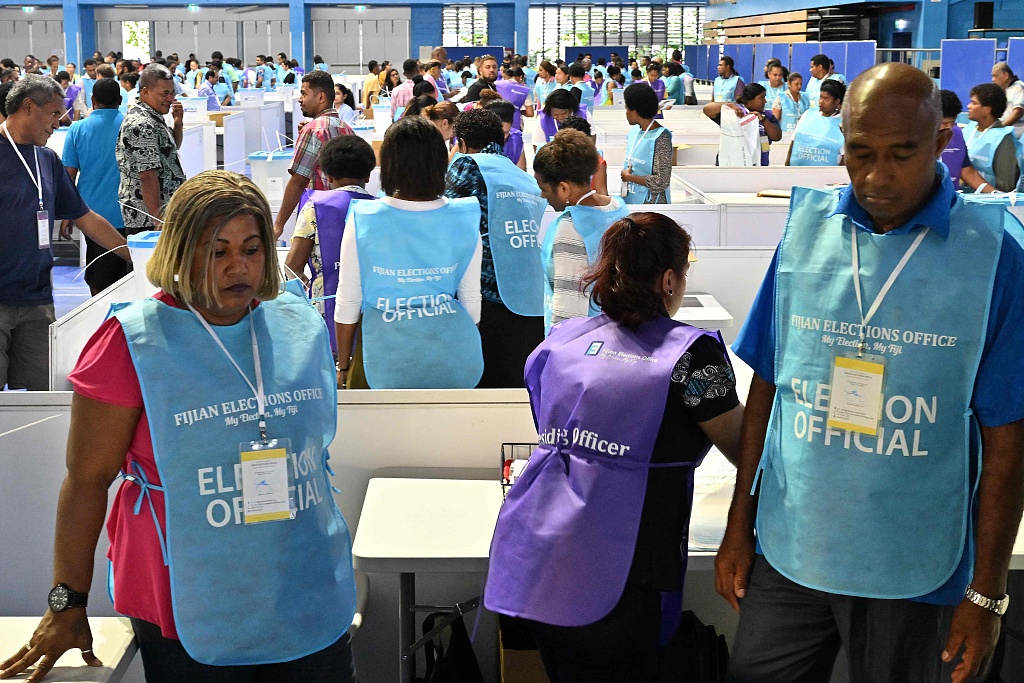 Election Commission officials prepare to open the ballot boxes for counting during Fiji's general election in the capital city Suva, Fiji, December 14, 2022. /CFP