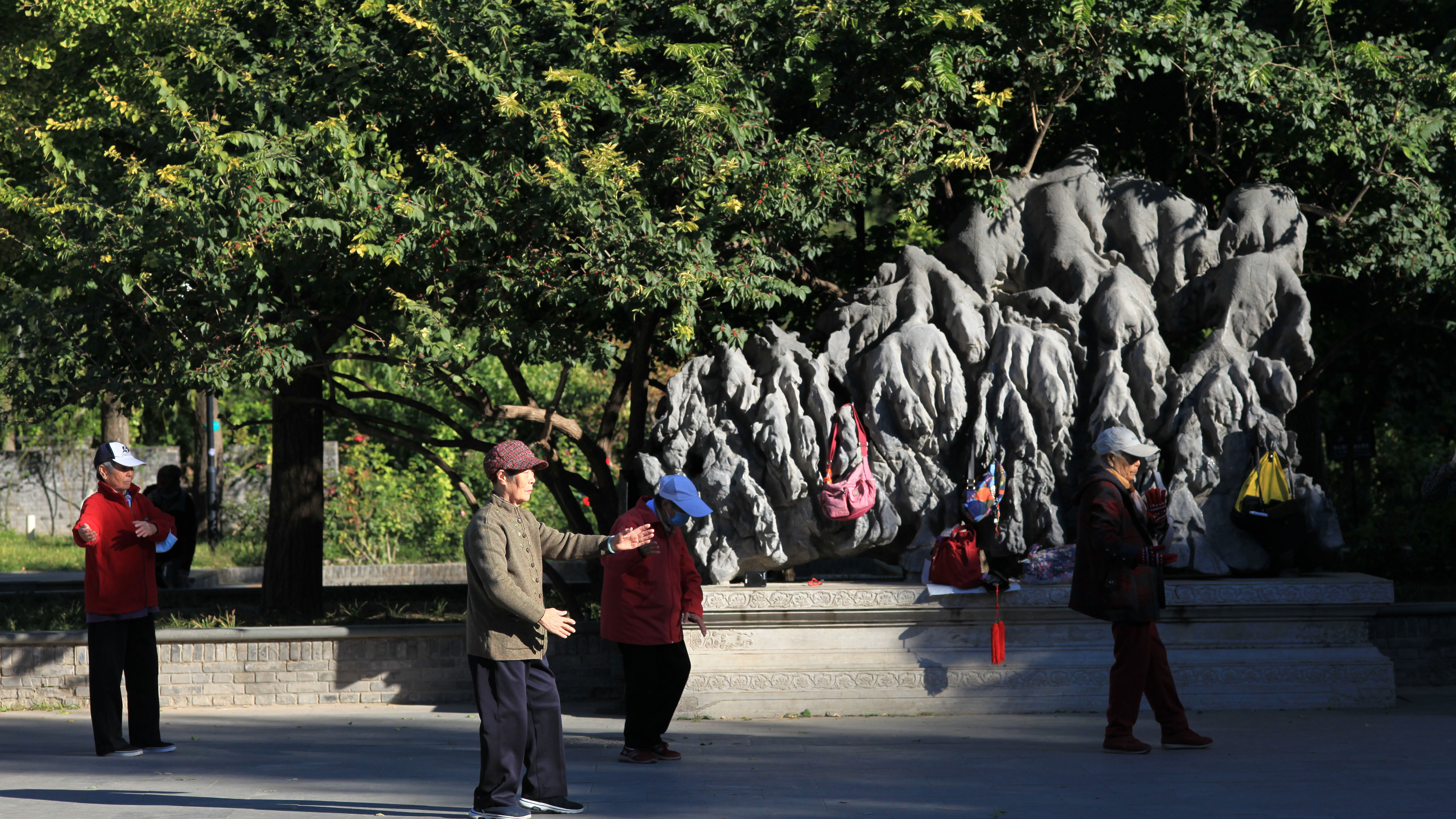 Senior citizens exercise at Yuetan Park in Beijing, China, October 10, 2022. /CFP