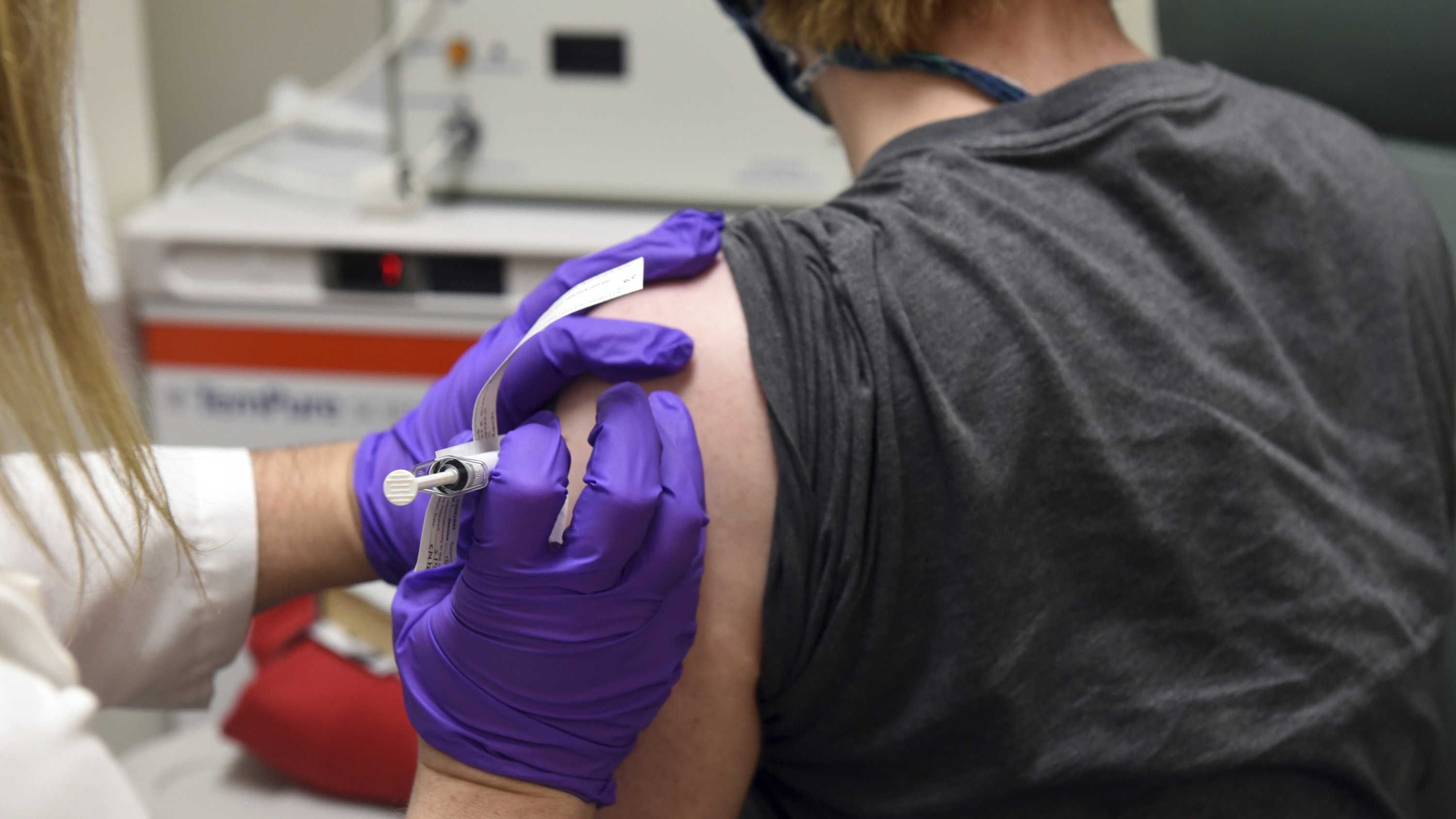 The first patient enrolled in Pfizer's COVID-19 coronavirus vaccine clinical trial receives an injection at the University of Maryland School of Medicine in Baltimore, U.S., May 4, 2020. /AP