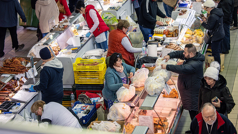 Customer shop for food items at Fehervari Street Market Hall in Budapest, Hungary, December 21, 2022. /CFP