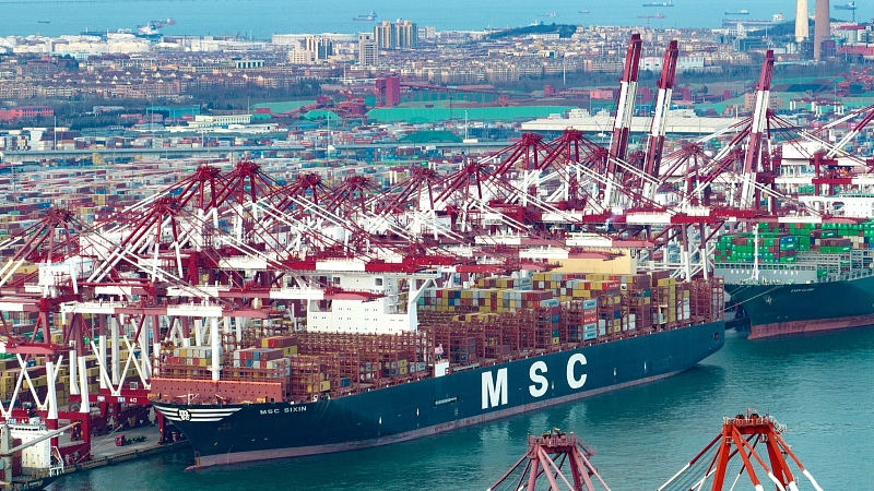 Containerships are busy unloading at Qianwan Container Terminal in Qingdao Port, east China's Shandong Province, December 21, 2022. /CFP