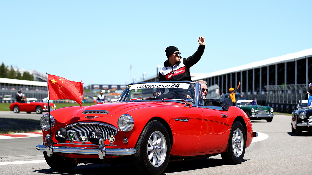 Zhou Guanyu waves to the crowd during the drivers' parade ahead of the race in Montreal, Canada, June 19, 2022. /CFP