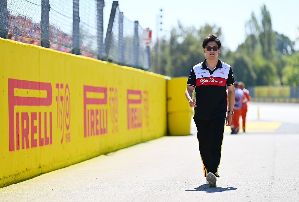 Zhou Guanyu walks to the circuit prior to the Italian GP race in Monza, Italy, September 11, 2022. /CFP 