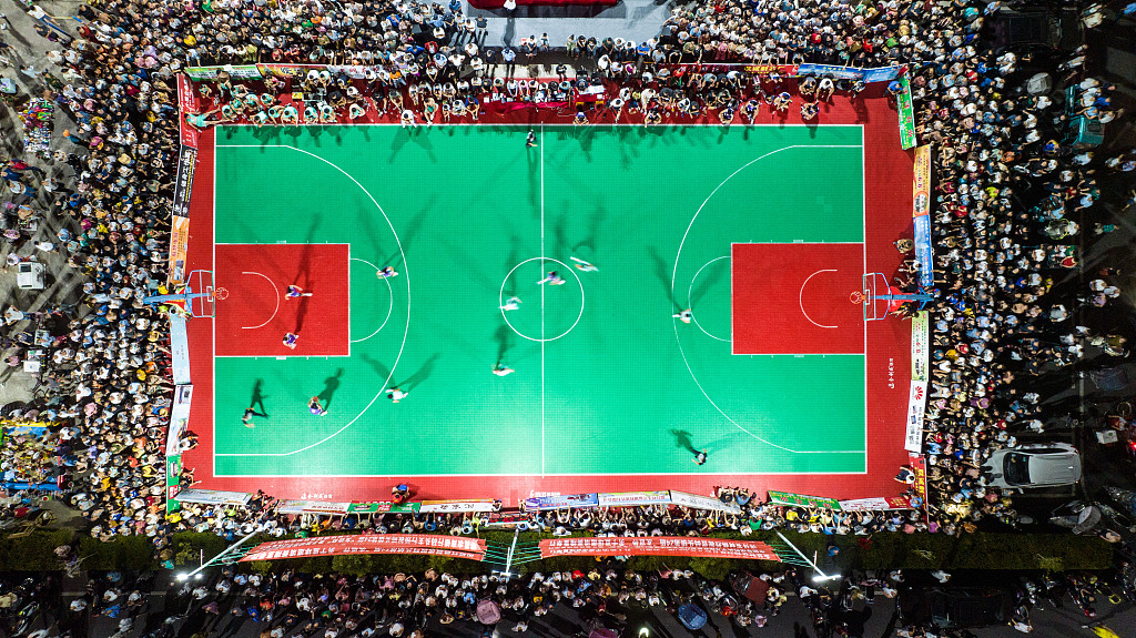 An aerial shot of a basketball match in a village in Ruichang City, Jiangxi Province, August 22, 2022. /CFP